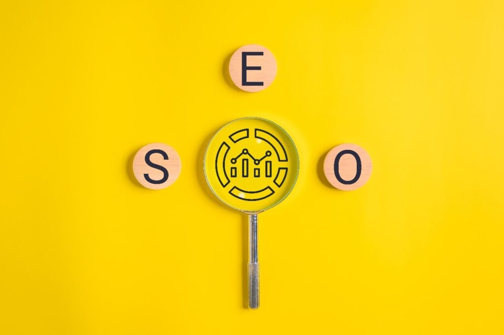 SEO A magnifying glass with the word seo in it on a yellow background.