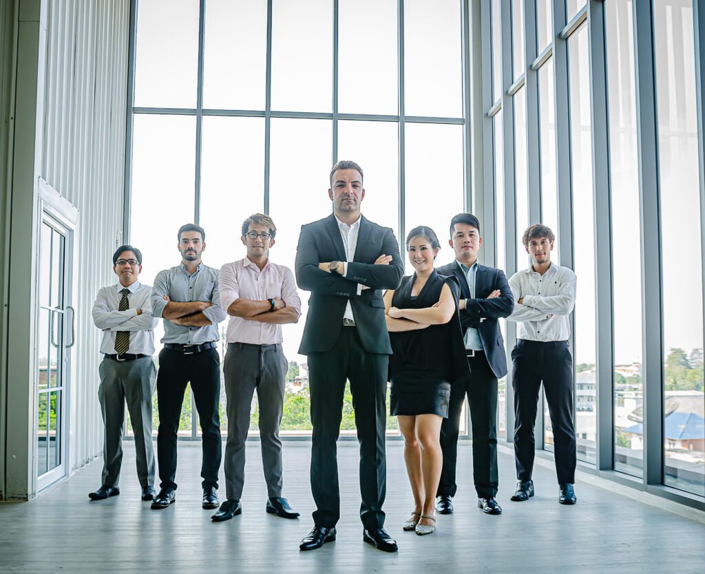 SEO Corporate team with confident poses in a modern office setting.