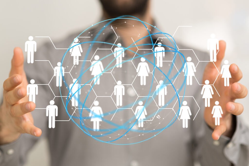 SEO Person holding a representation of a global social network with interconnected figures.