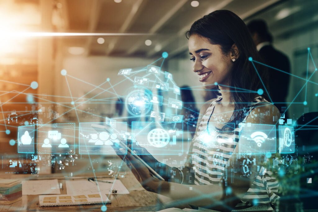 SEO In a modern office setting, a woman interacts with a digital tablet, surrounded by holographic icons symbolizing advanced technology and seamless connectivity, reflecting the innovative spirit of Burnesseo SEO Services.