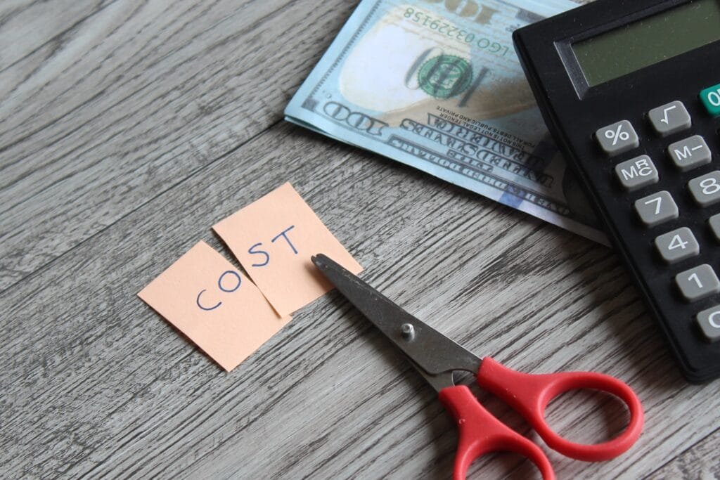 scissor calculator money and note with text cost 2023 11 27 05 29 36 utc