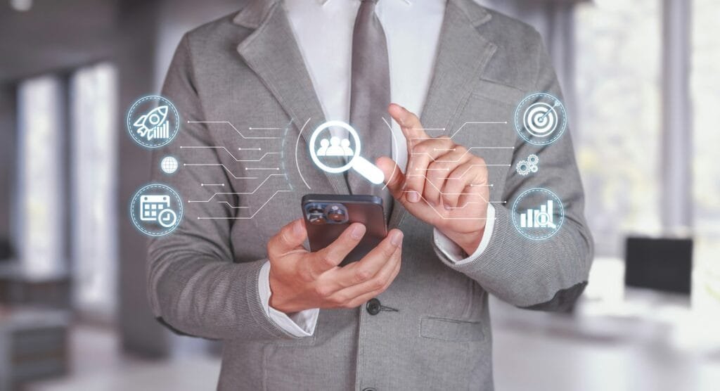 businessman using smartphone for seo analysis in modern office setting